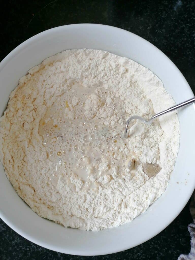 Add the liquid mixture to the flour and whisk with the dough